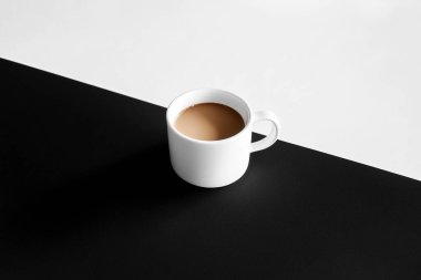 Minimalist Coffe Cup on Black and White Split Surface  Clean and Elegant Design clipart