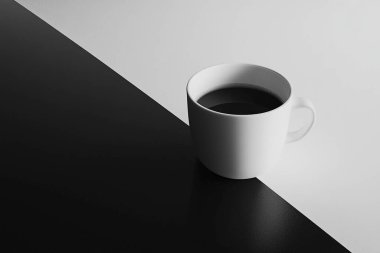 Minimalist Coffe Cup on Black and White Split Surface  Clean and Elegant Design clipart