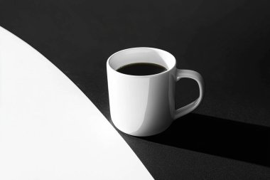 Minimalist Coffe Cup on Black and White Split Surface  Clean and Elegant Design clipart