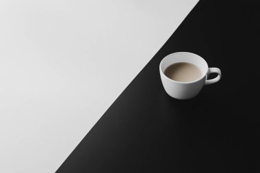 Minimalist Coffe Cup on Black and White Split Surface  Clean and Elegant Design clipart