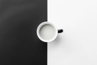 Minimalist Coffe Cup on Black and White Split Surface  Clean and Elegant Design clipart