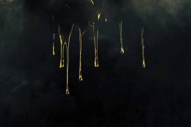 Gold Dripping on Black Smoke Background - Elegant Abstract Texture clipart