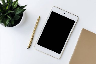 Minimalist Tablet and Pen Mockup on a Clean White Desk with Plant clipart