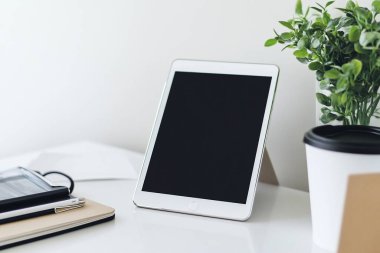 Minimalist Tablet and Stylus on Clean White Desk - Perfect for Graphic Designers