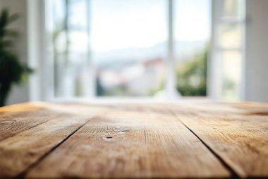 empty wooden table with a window