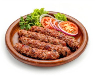 Savory grilled kebabs served on a wooden platter with fresh vegetables and herbs. clipart