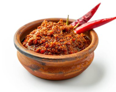 A rustic bowl of spicy red chili paste topped with fresh red chilies, showcasing vibrant colors and rich texture. clipart