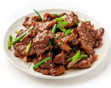 Delicious stir-fried beef slices garnished with green onions and sesame seeds. clipart