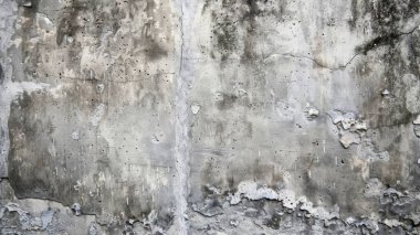 A weathered concrete wall displaying a mix of textures and shades of gray. clipart