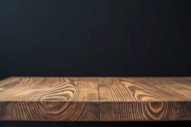 empty wooden table and black background