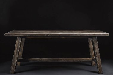 empty wooden table and black background.