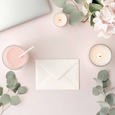 flat top view. modern laptop computer with envelope and pink peony flowers on light background. minimal style, workspace concept.