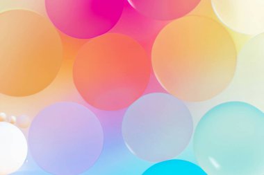 An array of colorful, translucent bubbles in soft pastel shades. clipart