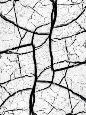 Abstract texture of cracked surface with intricate lines and patterns. clipart