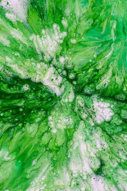 Abstract green and white fluid art creating a vibrant natural pattern. clipart