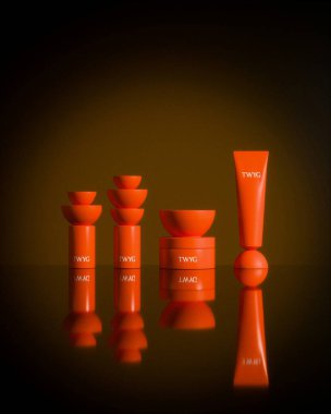 Vibrant red skincare products arranged artfully against a warm background. clipart