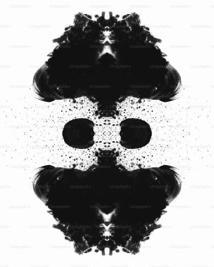 Abstract black ink blot art creating a symmetrical design. clipart