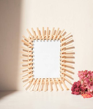 Stylish wooden frame with floral accents, showcasing minimalist decor aesthetics. clipart