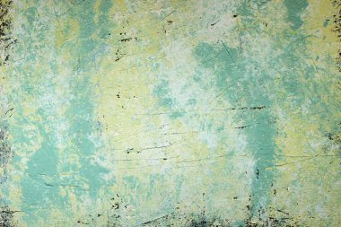 Textured abstract background in soft green and yellow hues. clipart