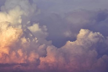 Majestic clouds at sunset create a mesmerizing color palette of soft pastels. clipart