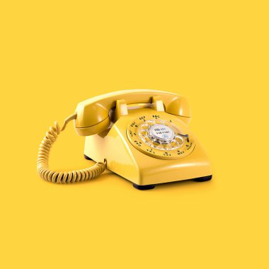 Vintage yellow rotary phone against a bright yellow background. clipart