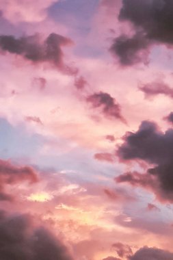 Beautiful sunset sky with pink and purple clouds. clipart