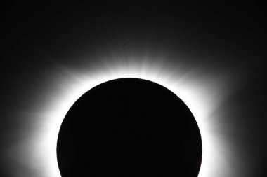 Spectacular solar eclipse showcasing the sun's corona. clipart