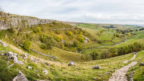 A multi image panorama of the steps down the side of Malham Cove seen whilst descending from the peak in the autumn of 2022.