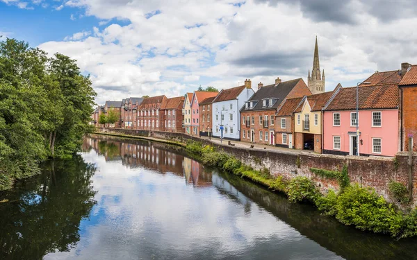 stock image Pretty multi coloured houses pictured from Fye Bridge lining the River Wensum in Norwich seen in August 2023.