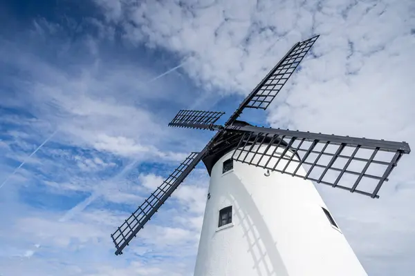 stock image Looking up at old windmill at Lytham on the Lancashire coast seen under a blue sky on 5 May 2024.