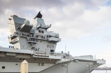 Sailors line the HMS Prince of Wales aircraft carrier as she prepares to depart Liverpool, Merseyside on 9 December 2024 after visiting the city for the second time. clipart