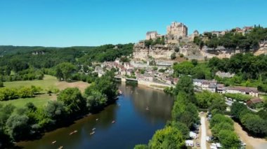 Aerial view Beynac castle and canoes on the river dordogne perigord France, High quality video