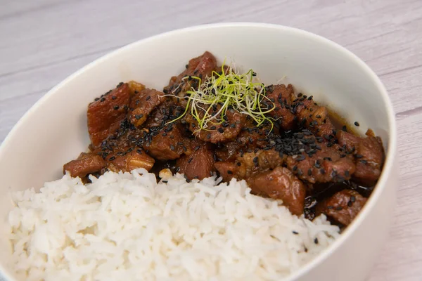 stock image Caramel pork recipe with rice and black sesame seeds. High quality photo