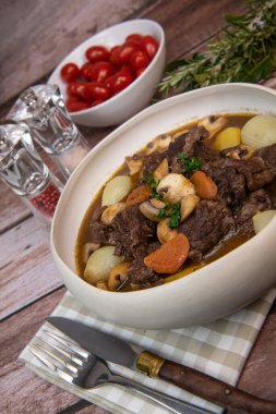 Beef bourguignon recipe, beef stew with wine sauce and vegetables. High quality photo