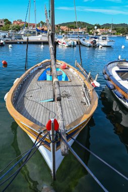 France, Porquerolles - June 09, 2024: Colourful traditional wooden fishing boats in the port reserved for professional fishermen on the island of Porquerolles. High quality photo clipart