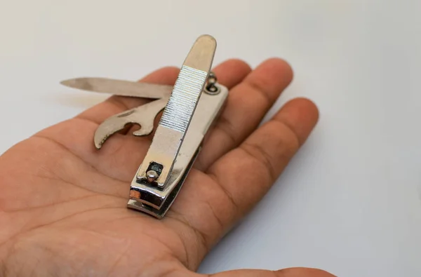 Female Hand Holding Nail Clippers Isolated White Background Selective Focus — Stock Photo, Image