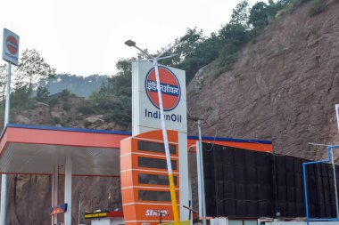 Kashmir, India- October 10,2024: Indian Oil Petrol Pump Canopy of Indian Oil Corporation on Himalayan mountain background at remote location of Hindustan Tibet trade route. clipart