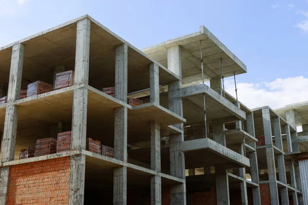 stock image A multi-storey building made of monolithic and red brick