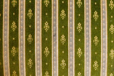 Light green fabric background with a pattern. Grunge style background.
