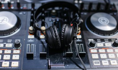Birthday decor, candies, ice cream, cheesecake on a background of grass near the house.