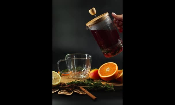 Stop Motion Hot Fruit Tea Pour Transparent Cup Oranges Black — Vídeo de stock