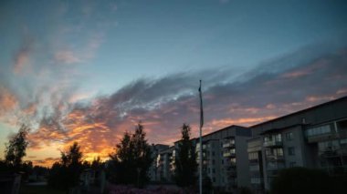 4K moving timelapse of cloud movement on sky beside a cityscape water pond.