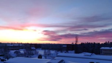 4K Panoramic view of beautiful winter wonderland colorful scenery in scenic golden evening light at sunset with clouds in Scandinavia, northern Europe. 