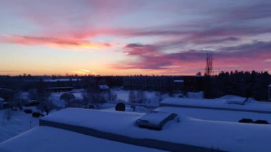 4K Panoramic view of beautiful winter wonderland colorful scenery in scenic golden evening light at sunset with clouds in Scandinavia, northern Europe. 