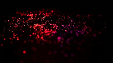 4K Soyut dijital parçacık dalgası ve ışık soyut arkaplan, animasyon siber veya teknoloji arka planı. Havai fişek festivali. Siyah arka planda izole edilmiş. Parlayan Parçacıklar.