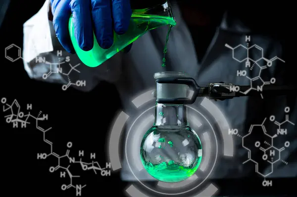 A woman scientist experimenting with a green fluorescent solution in a glass round bottom flask in dark chemistry laboratory for health care medicine development. Copy space black background