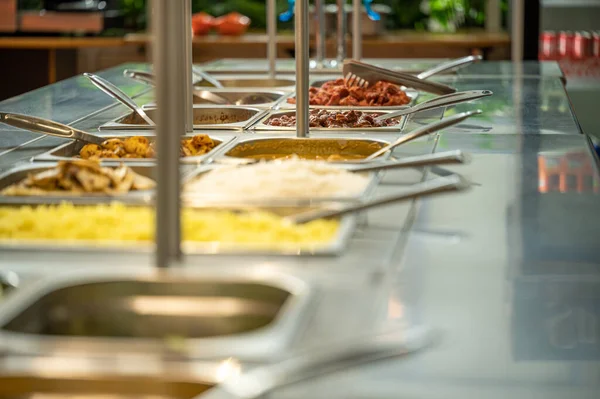 Asian food buffet in restaurant multiple food dishes and salad. Eat as much as you like Indian buffet restaurant. You can buy delicious food at an affordable price. Copyspace.