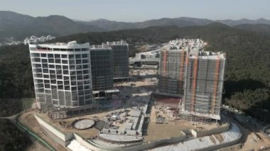 Building Under Construction Aerial View at Tourism Complex OSIRIA in GIJANG, South Korea. High quality 4k footage