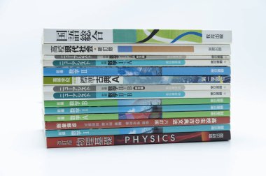 Fuji-Shi, Shizuoka-Ken, Japan - August 9, 2022: Stacked Japanese school books. Isolated on white background.