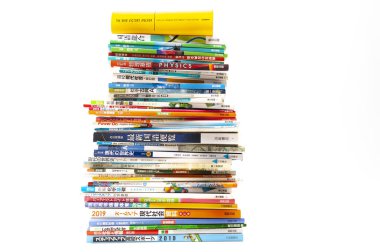 Fuji-Shi, Shizuoka-Ken, Japan - August 9, 2022: Stacked Japanese school books. Isolated on white background.